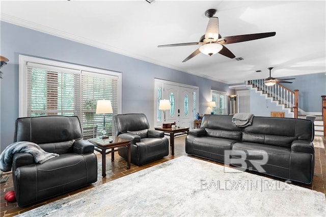 living room with crown molding and ceiling fan