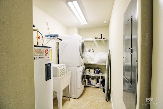 washroom featuring light tile patterned floors, sink, stacked washer / dryer, and water heater