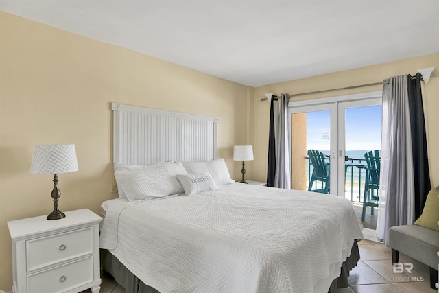969 W Beach Blvd Unit 1503A, Gulf Shores, AL 36542 - bedroom with access to outside, light tile patterned floors, and a water view