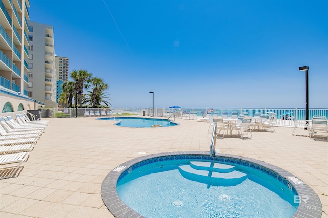 969 W Beach Blvd Unit 1503A, Gulf Shores, AL 36542 - community pool featuring a patio and a water view