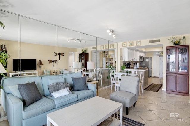 969 W Beach Blvd Unit 1503A, Gulf Shores, AL 36542 - living area featuring light tile patterned floors and rail lighting