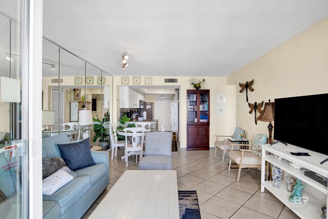 969 W Beach Blvd Unit 1503A, Gulf Shores, AL 36542 - living room with light tile patterned floors and rail lighting