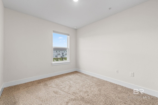 unfurnished room featuring carpet