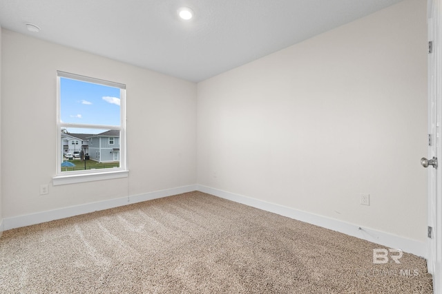 spare room featuring carpet flooring