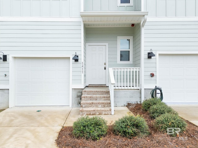 doorway to property with a garage