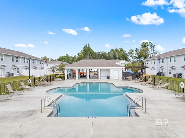 view of swimming pool with a pergola and a patio area