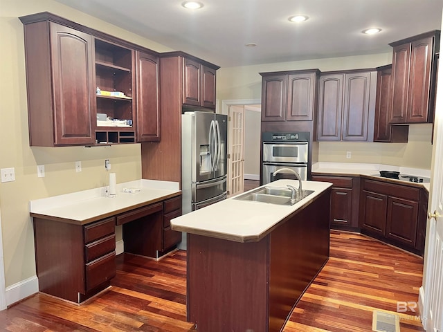 151 Mockingbird Ln, Atmore, AL 36502 - kitchen featuring appliances with stainless steel finishes, dark wood finished floors, a sink, light countertops, and recessed lighting