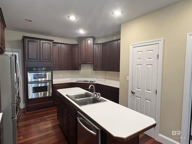 151 Mockingbird Ln, Atmore, AL 36502 - kitchen featuring a sink, appliances with stainless steel finishes, dark brown cabinetry, dark wood finished floors, and recessed lighting