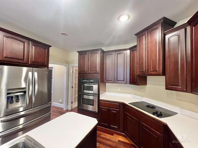 151 Mockingbird Ln, Atmore, AL 36502 - kitchen featuring appliances with stainless steel finishes, light countertops, and dark wood-style floors