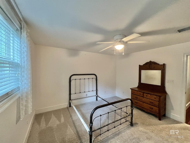 151 Mockingbird Ln, Atmore, AL 36502 - carpeted bedroom featuring baseboards and a ceiling fan