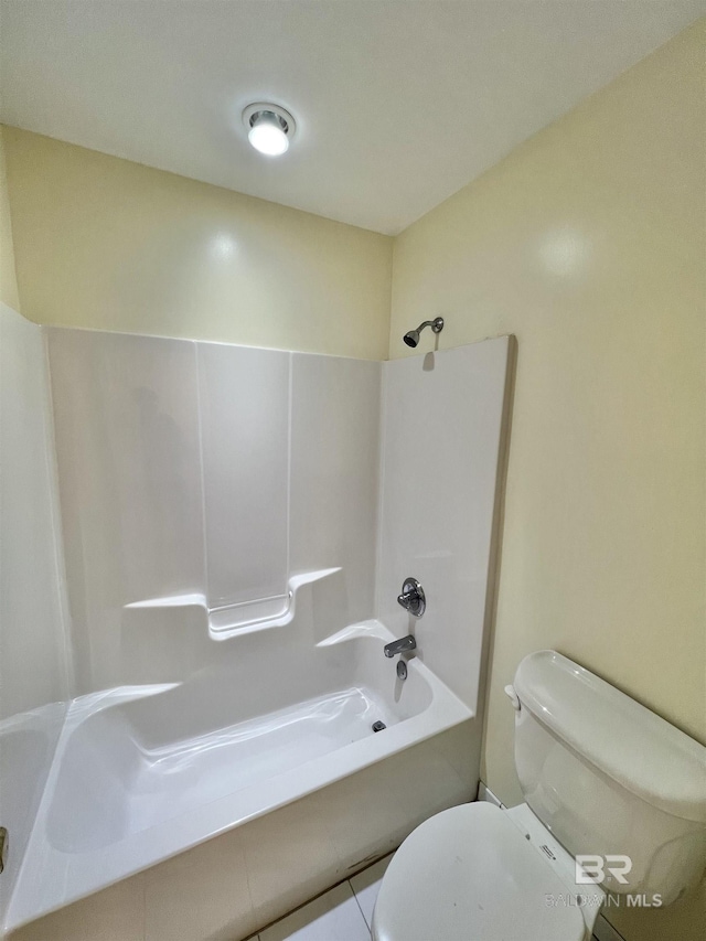 151 Mockingbird Ln, Atmore, AL 36502 - bathroom featuring toilet,  shower combination, and tile patterned flooring