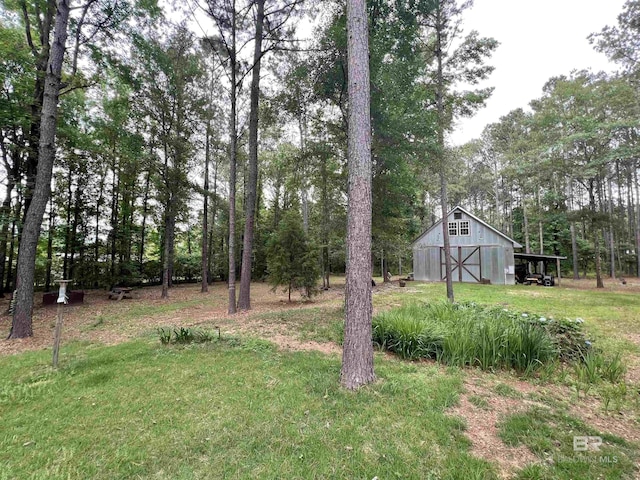 151 Mockingbird Ln, Atmore, AL 36502 - view of yard featuring a barn and an outdoor structure