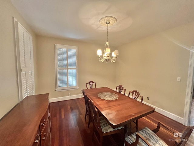 151 Mockingbird Ln, Atmore, AL 36502 - dining space with dark wood finished floors, baseboards, and a chandelier