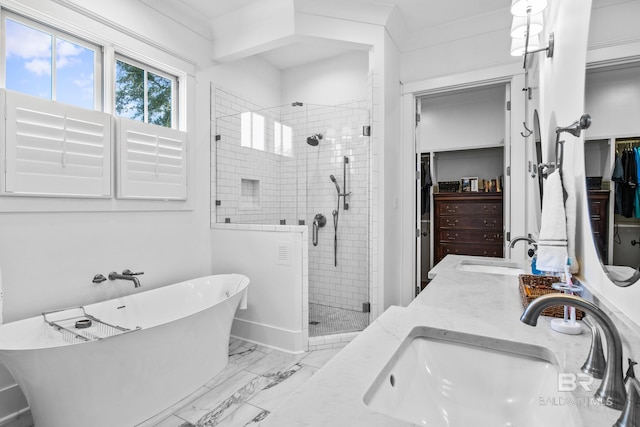 bathroom with plus walk in shower, tile patterned flooring, and dual bowl vanity