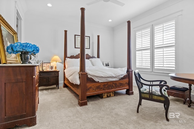 carpeted bedroom with ceiling fan and crown molding