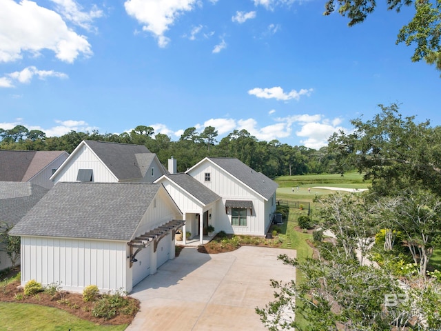 view of front of home with a front yard and a garage