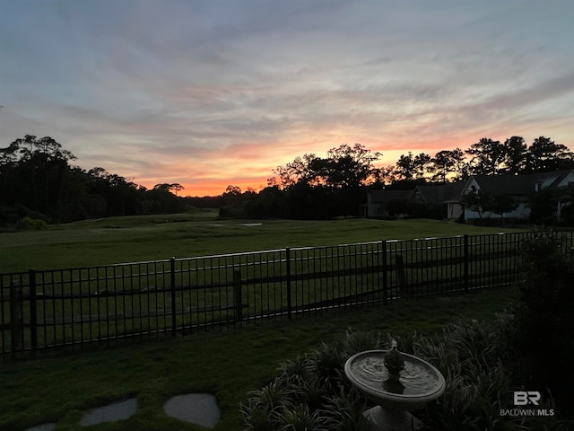 view of yard at dusk