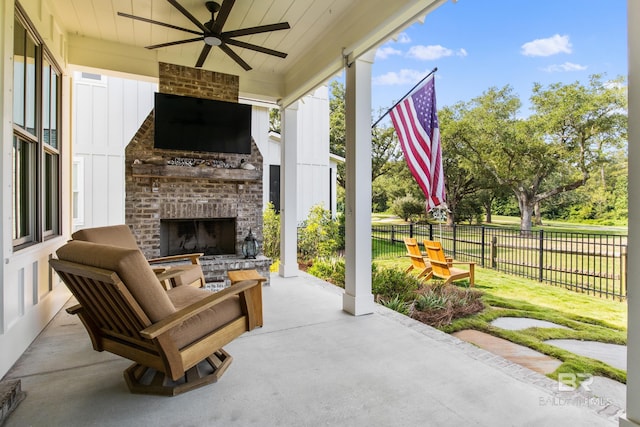 view of patio / terrace with an outdoor brick fireplace and ceiling fan