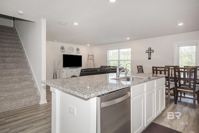 10909 Blacktail Loop, Pensacola, FL 32526 - kitchen featuring stainless steel dishwasher, light wood-style floors, light stone countertops, white cabinets, and recessed lighting