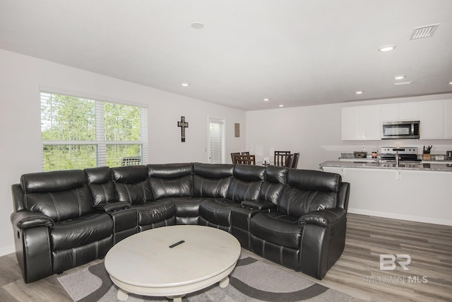 10909 Blacktail Loop, Pensacola, FL 32526 - living area featuring wood finished floors and recessed lighting