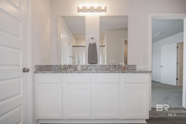 10909 Blacktail Loop, Pensacola, FL 32526 - bathroom with double vanity and baseboards