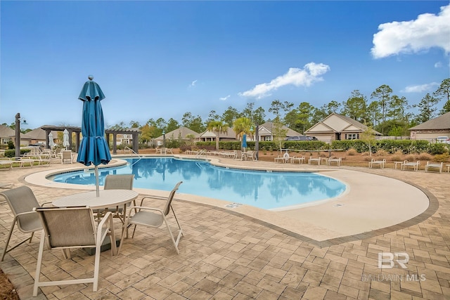 10909 Blacktail Loop, Pensacola, FL 32526 - community pool with a patio area