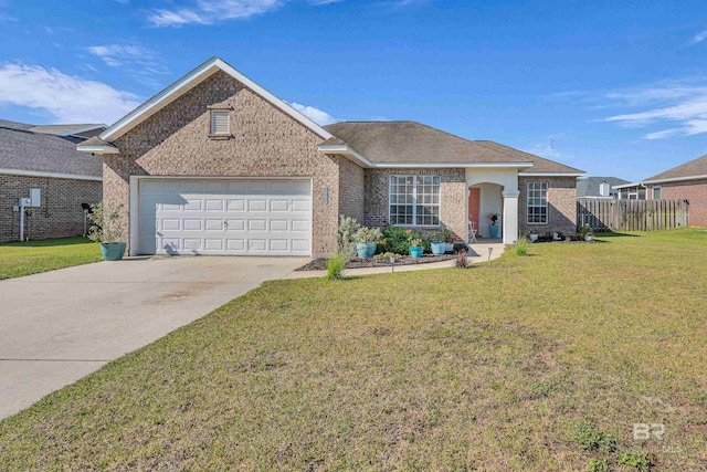 single story home featuring brick siding, fence, an attached garage, concrete driveway, and a front yard