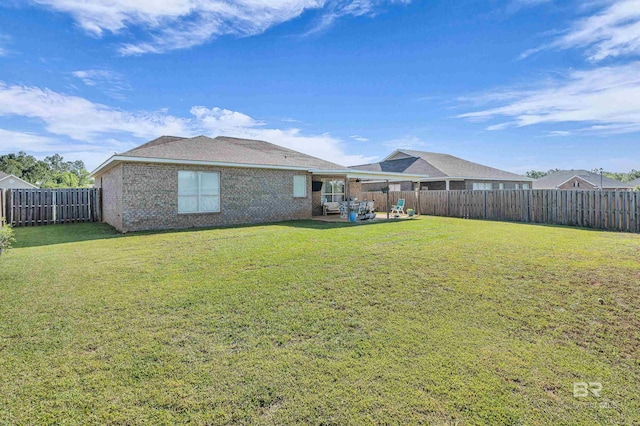 view of yard featuring a patio and a fenced backyard