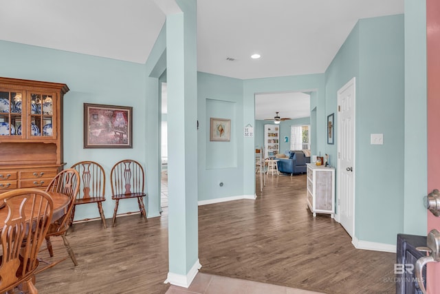 interior space with recessed lighting, baseboards, visible vents, and wood finished floors
