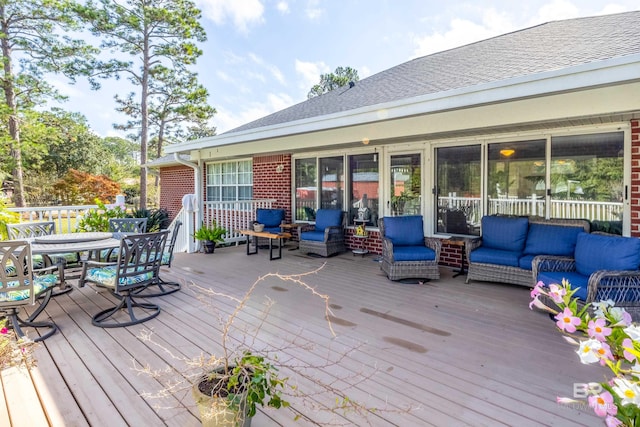 wooden terrace featuring an outdoor hangout area