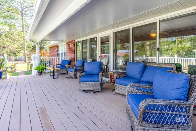 wooden terrace with an outdoor hangout area