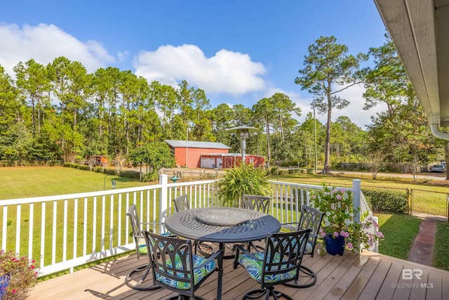 wooden terrace with a yard