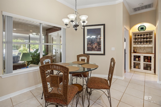 dining area with a chandelier, light tile patterned floors, and crown molding