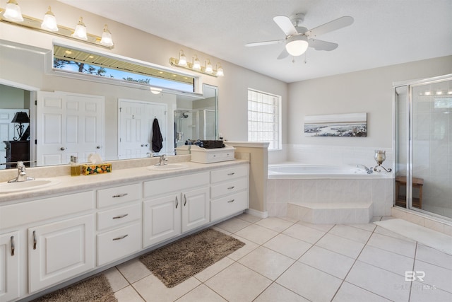 bathroom with tile patterned flooring, vanity, separate shower and tub, and ceiling fan