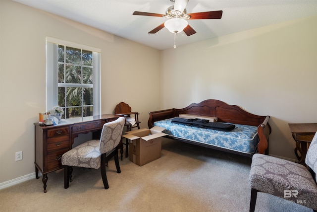 bedroom with ceiling fan and light colored carpet