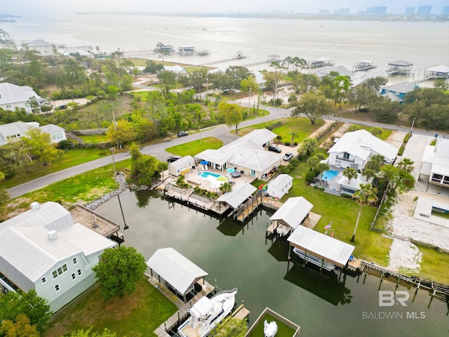 birds eye view of property with a water view