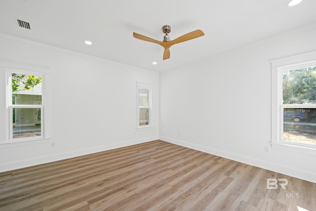 unfurnished room with light wood-type flooring, ceiling fan, and crown molding