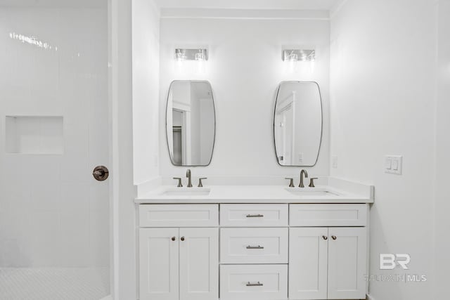 bathroom featuring walk in shower and vanity