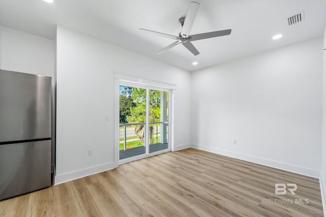 unfurnished room with light hardwood / wood-style floors and ceiling fan