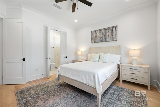 16761 Perdido Key Dr, Pensacola, FL 32507 - bedroom featuring ornamental molding, connected bathroom, ceiling fan, and hardwood / wood-style floors