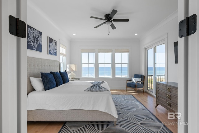 16761 Perdido Key Dr, Pensacola, FL 32507 - bedroom with multiple windows, a water view, and hardwood / wood-style flooring