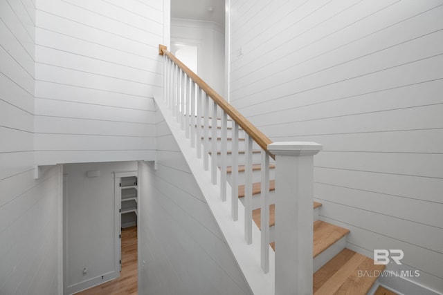 16761 Perdido Key Dr, Pensacola, FL 32507 - staircase featuring hardwood / wood-style flooring and wooden walls