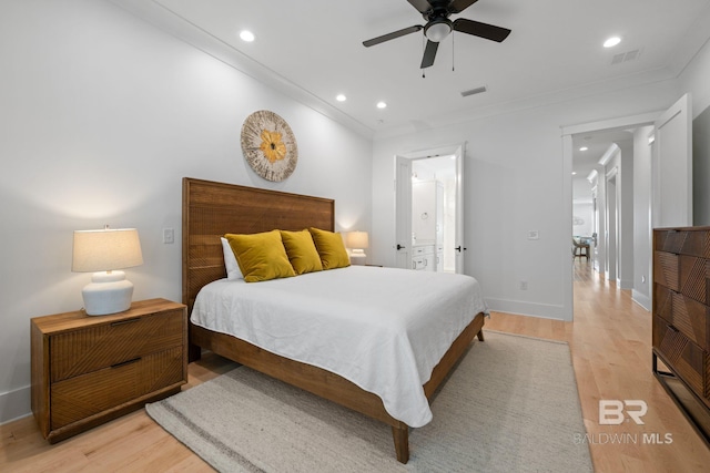 16761 Perdido Key Dr, Pensacola, FL 32507 - bedroom with ornamental molding, light wood-type flooring, ceiling fan, and connected bathroom