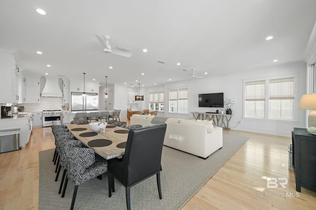 16761 Perdido Key Dr, Pensacola, FL 32507 - dining room with light hardwood / wood-style flooring, ceiling fan, and a wealth of natural light