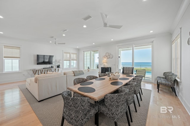 16761 Perdido Key Dr, Pensacola, FL 32507 - dining room featuring ceiling fan, crown molding, and light hardwood / wood-style floors