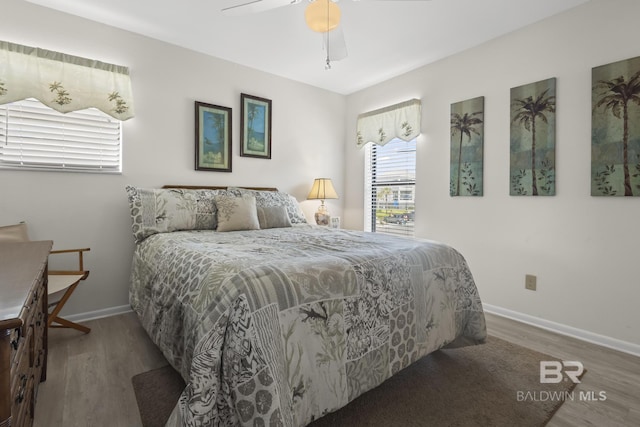 bedroom featuring hardwood / wood-style floors and ceiling fan