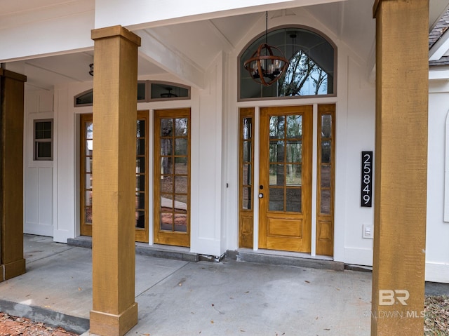 property entrance with a porch and board and batten siding