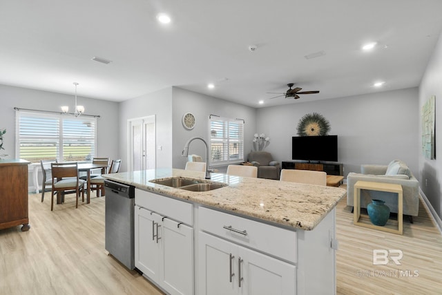 4175 Montague Dr, Gulf Shores, AL 36542 - kitchen featuring dishwasher, a kitchen island with sink, a chandelier, light wood-style flooring, and recessed lighting