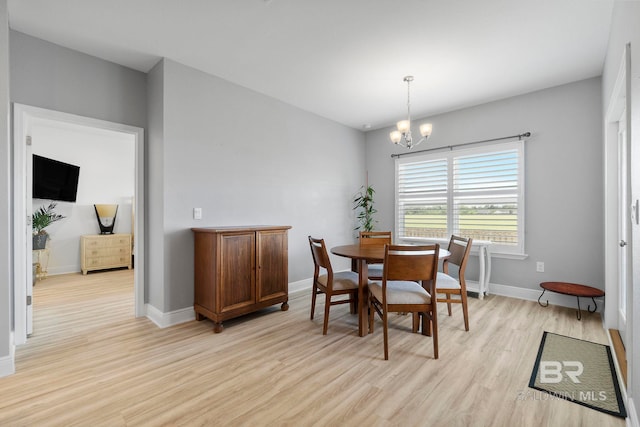 4175 Montague Dr, Gulf Shores, AL 36542 - dining area with light wood-style floors and a chandelier