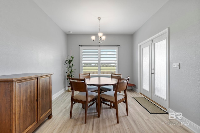 4175 Montague Dr, Gulf Shores, AL 36542 - dining space featuring light wood-type flooring, a chandelier, and french doors